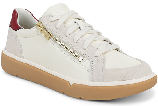 A low-top sneaker with a white leather and suede upper, a gold zipper detail along the side, a maroon heel tab, and a thick, light-brown rubber platform sole.