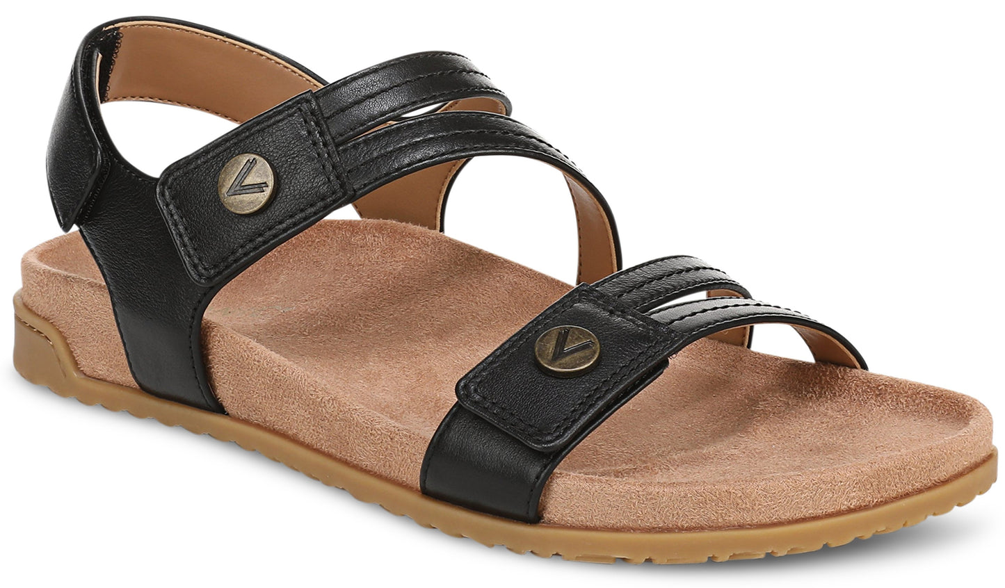 Black flat sandal with two straps featuring decorative metal buttons and adjustable velcro closures.