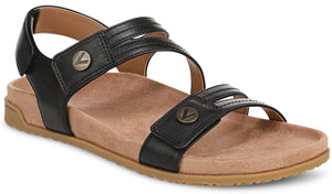 Black flat sandal with two straps featuring decorative metal buttons and adjustable velcro closures.