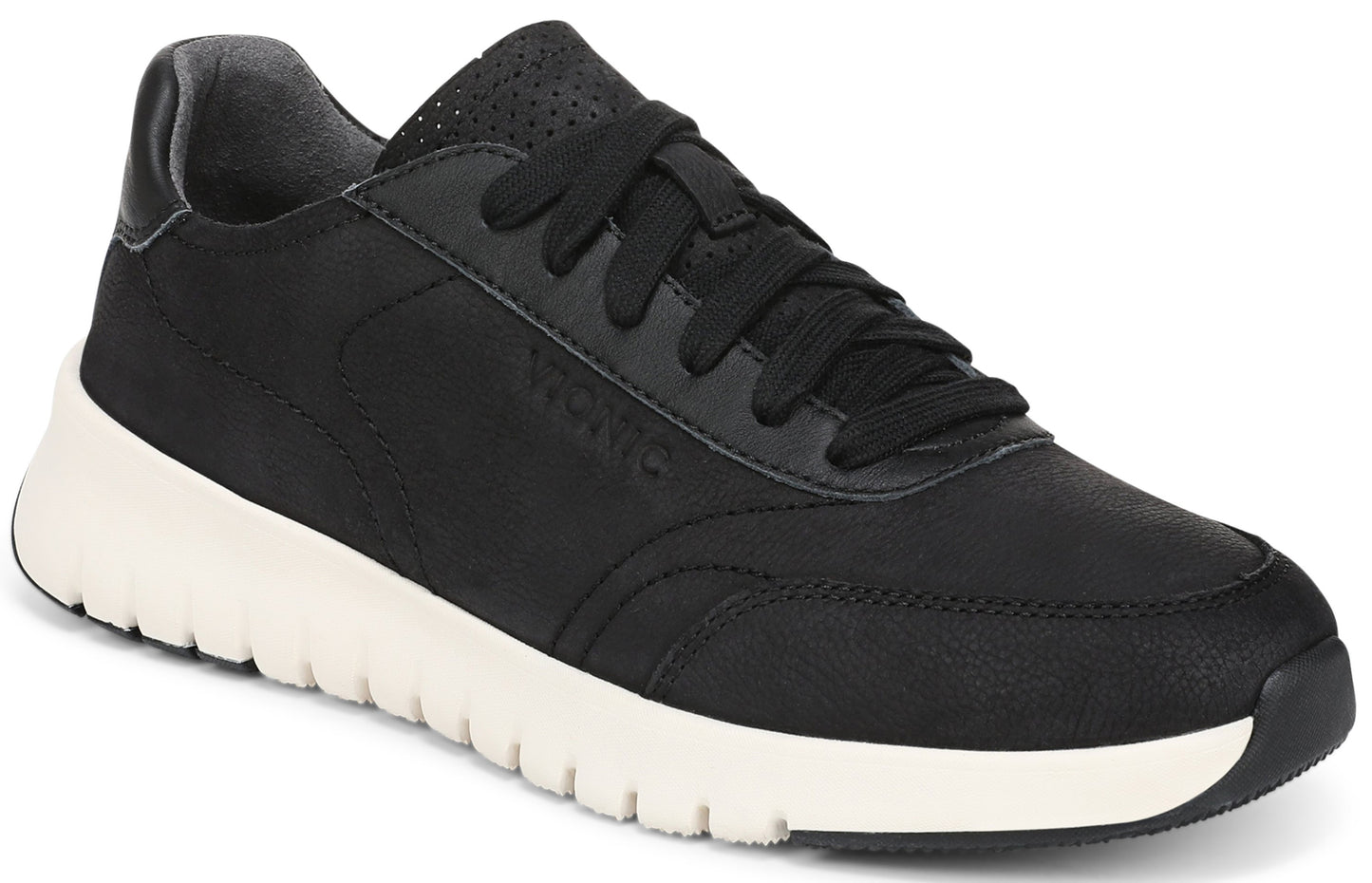 A black leather sneaker with a thick, textured white sole, black laces, and perforated detailing on the tongue, showing the word "Vionic" debossed on the side.