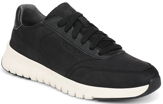 A black leather sneaker with a thick, textured white sole, black laces, and perforated detailing on the tongue, showing the word "Vionic" debossed on the side.