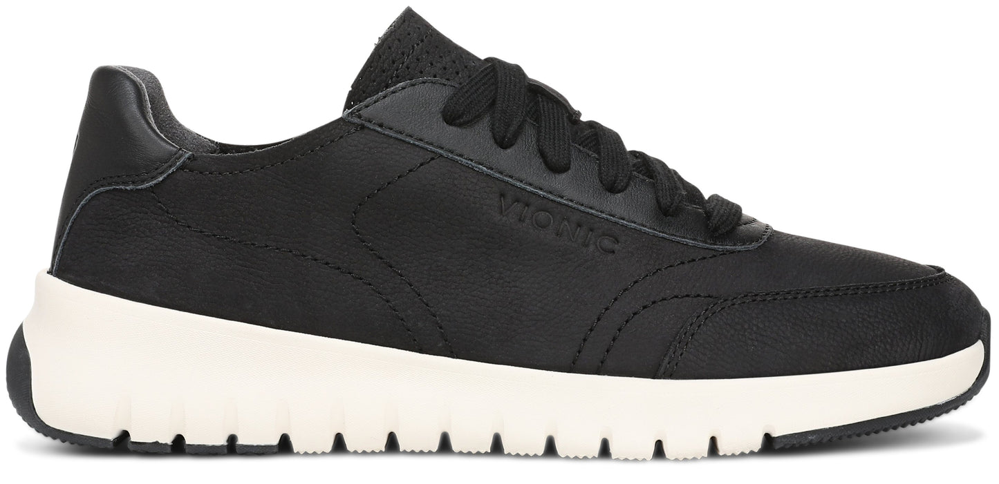 A black leather lace-up sneaker with a chunky white midsole and black textured outsole, featuring the brand name Vionic embossed on the side panel.