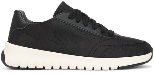 A black leather lace-up sneaker with a chunky white midsole and black textured outsole, featuring the brand name Vionic embossed on the side panel.