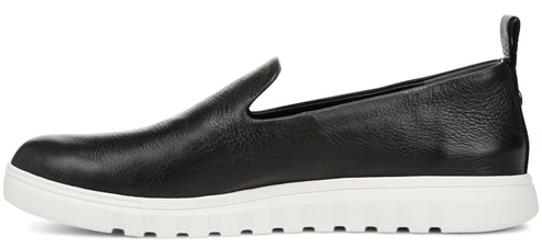 A black leather slip-on shoe with a white sole.