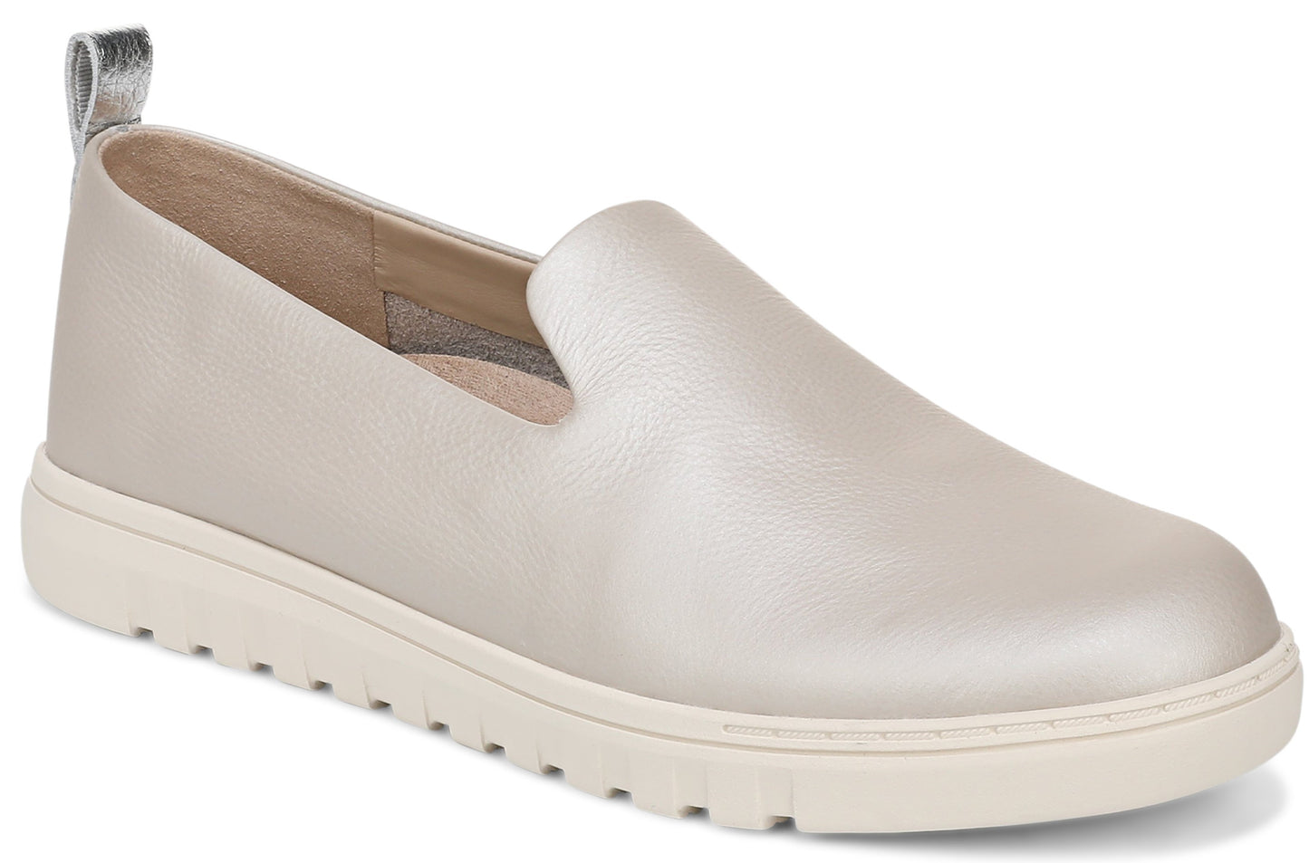 Beige leather slip-on shoe with a silvery heel tab and a ribbed white sole.