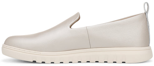 A slip-on shoe with a flat, light-colored sole and a silver upper.