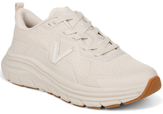 Beige athletic shoe with a thick sole and a brown gum colored outer sole.