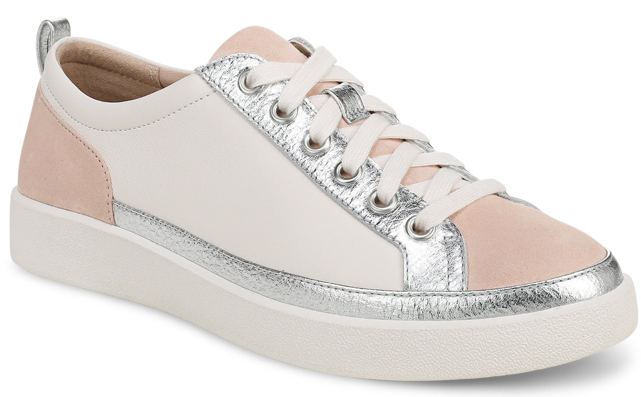 Low-top sneaker with white leather upper, pink accents on toe and heel, silver trim and eyelets, and white laces and sole.