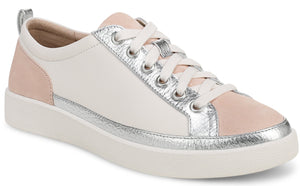 Low-top sneaker with white leather upper, pink accents on toe and heel, silver trim and eyelets, and white laces and sole.