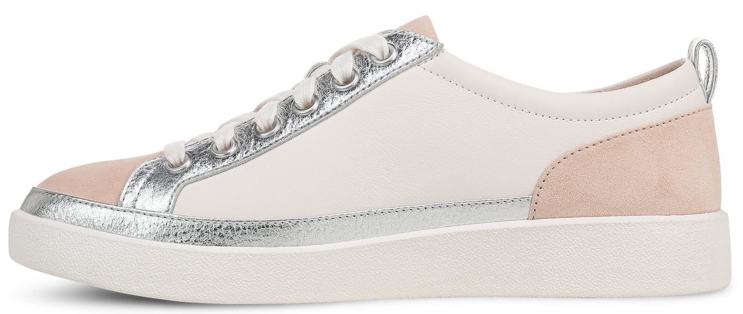 A white sneaker with a silver trim and pink heel.