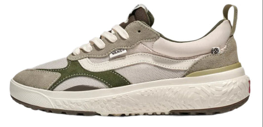 A sneaker featuring a white body, white laces, grey trim, and green accents.