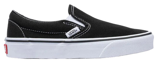 A black slip-on canvas shoe with white stitching, white rubber sidewalls with a thin black stripe, and a small white tag with black lettering reading VANS on the outer side.