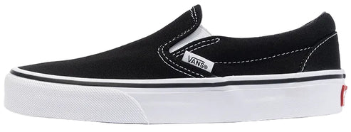 A black slip-on canvas shoe with a thick white rubber sole, white stitching, and a small white brand tag on the side.