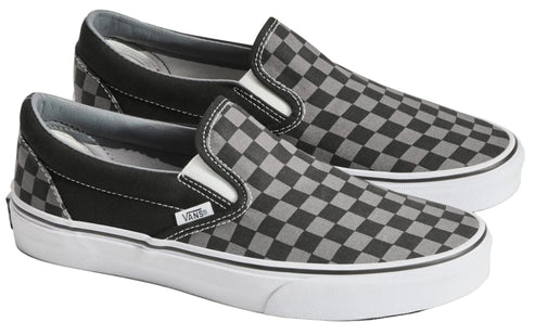 A pair of checkered slip-on shoes with white soles.