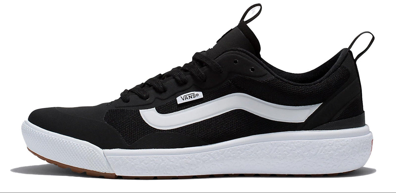 A black sneaker with a white stripe on a white sole.