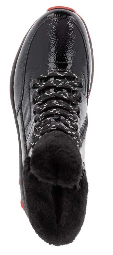 A black patent leather boot with faux fur lining and a black and white lace.