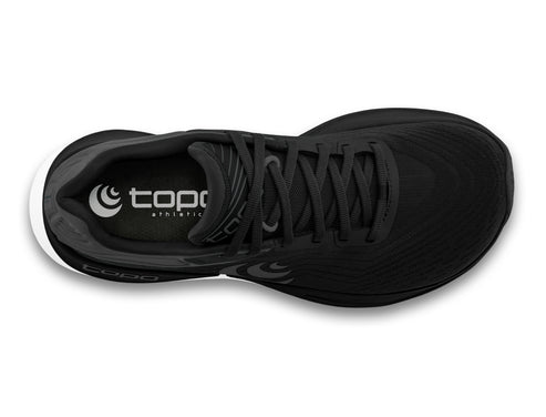 Black athletic shoe seen from above showing laces and the text "topo athletic".