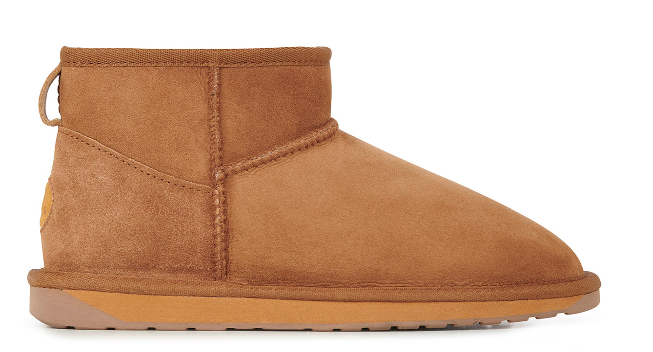 Short brown suede boot with tan sole and pull tab.