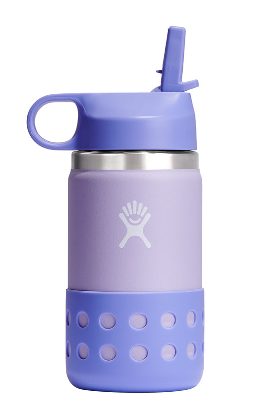 A purple, metal bottle with a straw lid and a protective sleeve around the base featuring a pattern of circular cutouts.