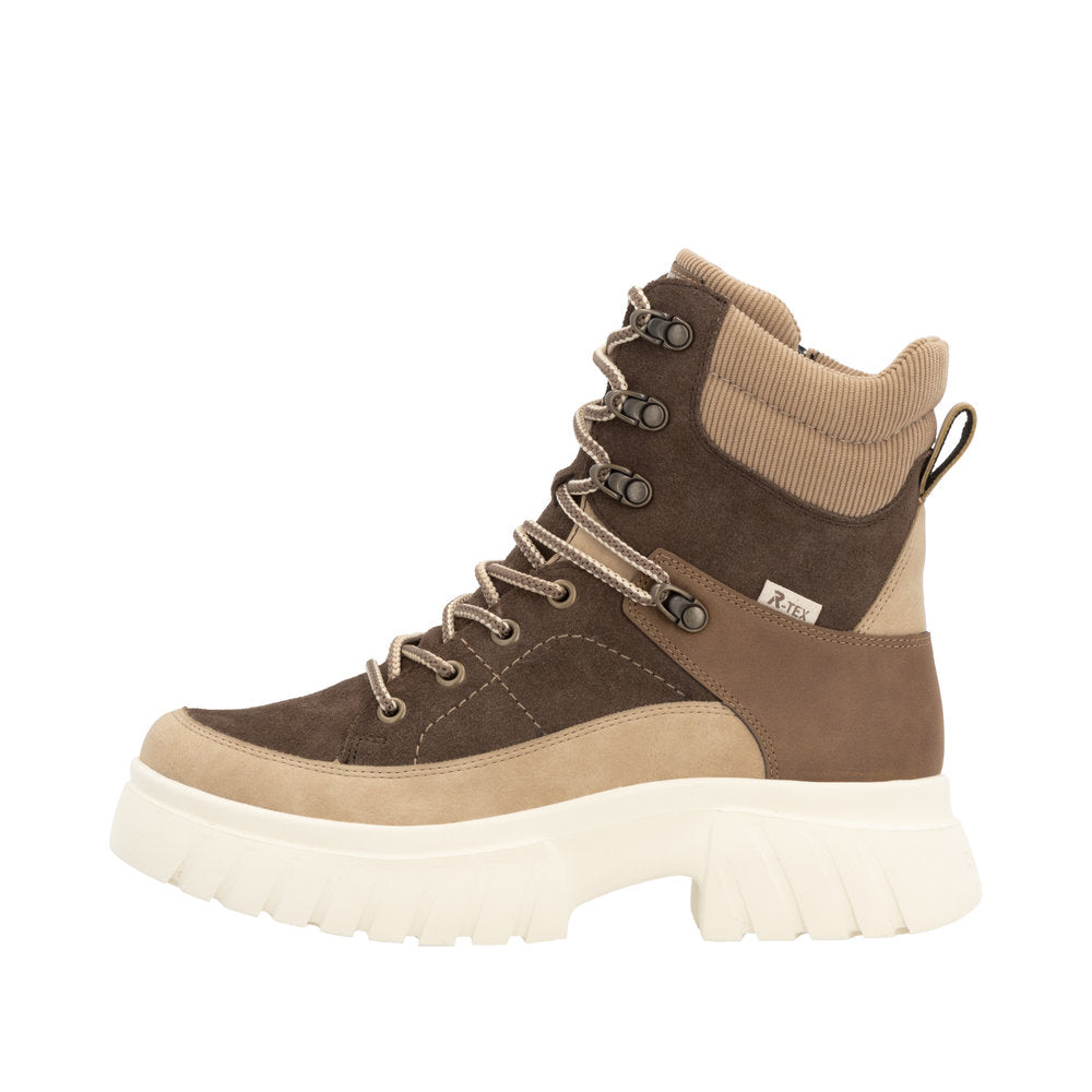 Brown and tan high-top boot with laces and thick white sole.