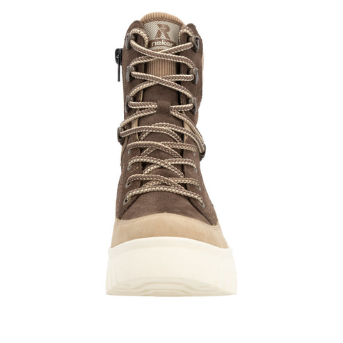 Front view of a mid-calf brown suede boot with light tan laces and a thick white sole.