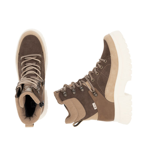 Two brown and beige hiking boots with laces and thick white soles.