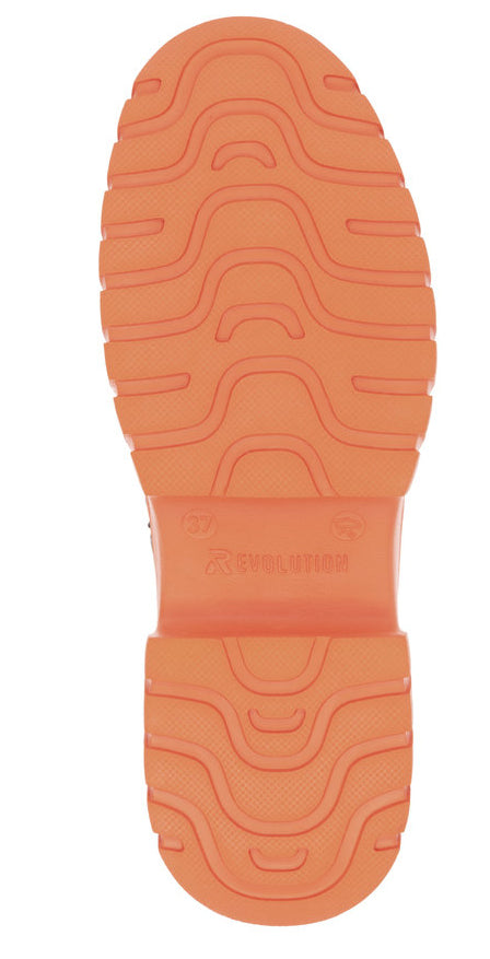 Close-up of a shoe's orange sole with wavy and line treads. Visible text: "BOOMERANG".