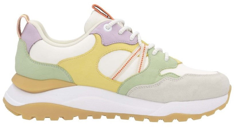 Side view of a sneaker with a white sole and an upper composed of white, grey, yellow, light-green and lavender sections.