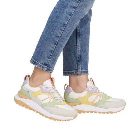 A pair of colorful running shoes featuring yellow, lavender and green panels with white laces on a white platform sole.