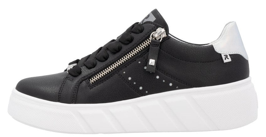 A black sneaker with a zipper, a silver heel patch, and a white platform sole.