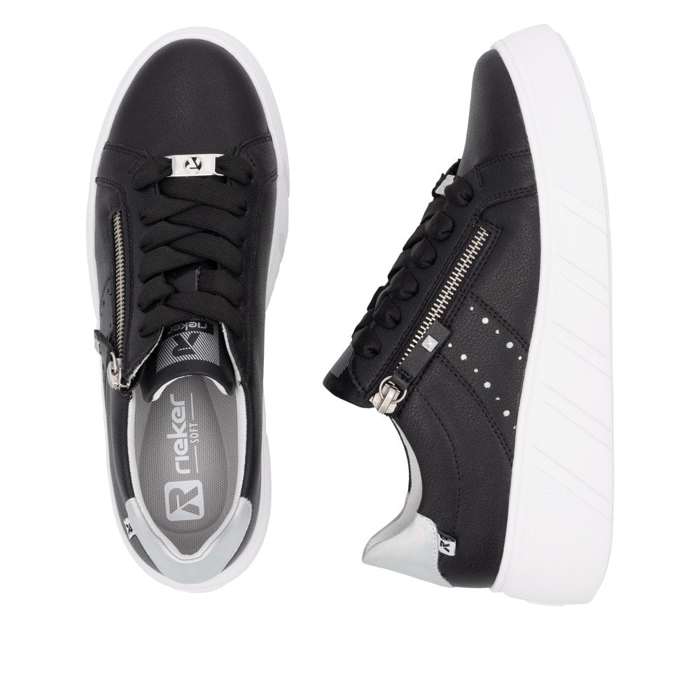 Two black sneakers, one top-down view, one side view, with white soles, black laces, and silver accents.