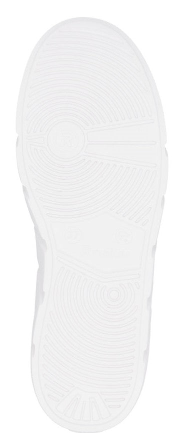 A white shoe sole with concentric grooves.