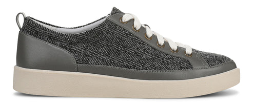 A gray low-top sneaker with white laces and a cream-colored sole.
