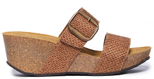 Woven fabric wedge sandal with a bronze buckle.