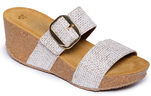 Womens' sandal with a wide, gold buckle and cork wedge heel.
