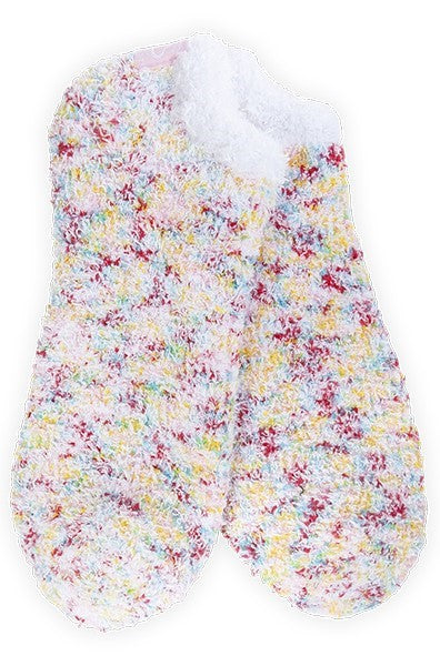 Pair of white fuzzy socks with flecks of red, yellow, and blue.