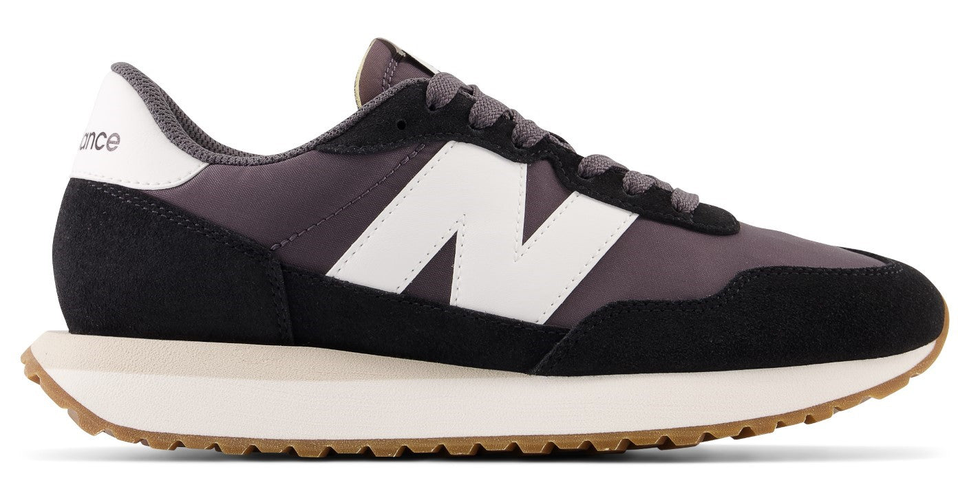 Black and gray sneaker with white side logo and light brown sole.