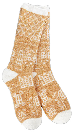 Tan fuzzy socks with white gingerbread house designs and white toe, heel, and cuff.