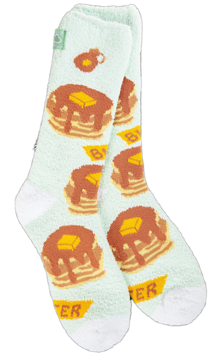 Pair of light green socks featuring pancakes with butter and syrup.