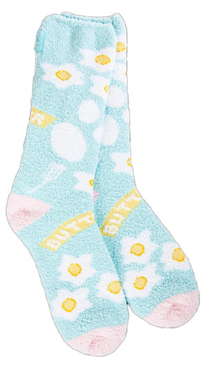 Pair of light blue socks with daisy and polka-dot pattern and text "BUTTER".