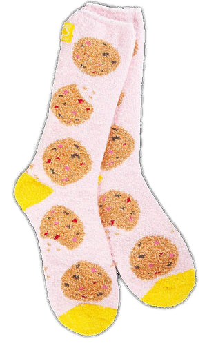 Pair of fuzzy pale pink socks with cookie pattern and yellow accents.