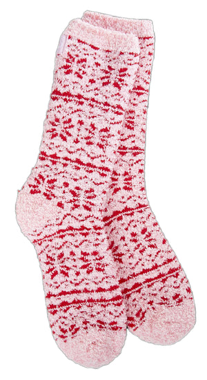 Pair of fuzzy pink socks with red stripes.