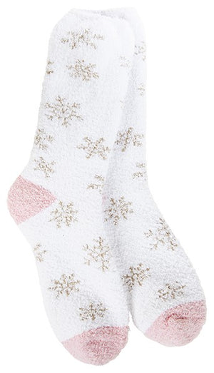 Pair of white fuzzy socks with pink toes and heels, patterned with light gray snowflakes.