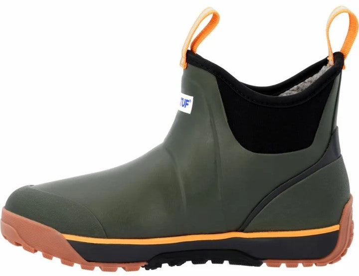 A slip-on ankle boot in olive green rubber with a black neoprene upper, featuring orange pull loops at the front and back, an orange midsole stripe, and a lugged brown and black outsole, with the partial logo 'TUF' visible on the side.