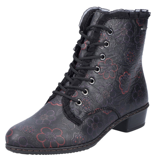 A black, ankle-high boot with a red floral pattern, a lace-up front, and a low heel.