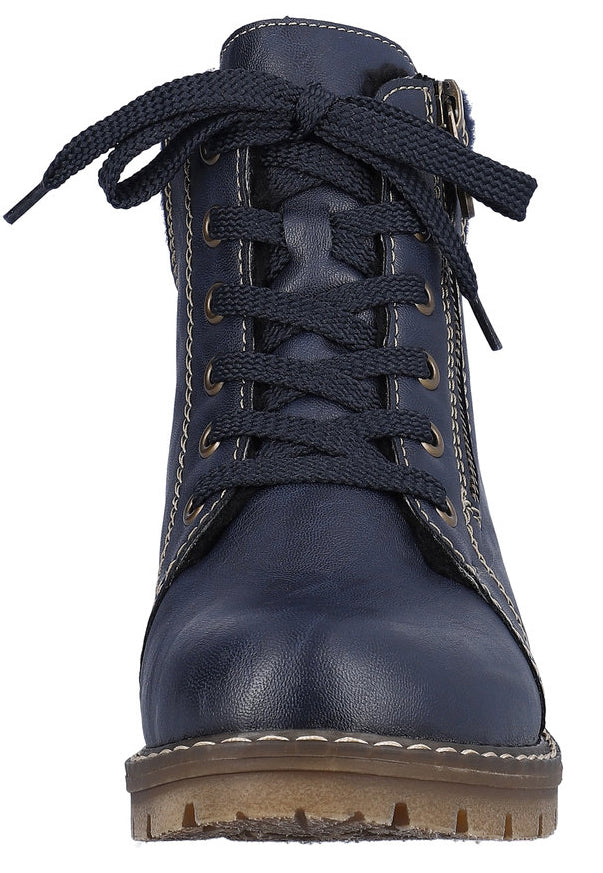 Blue lace-up ankle boot with side zipper and lug sole.