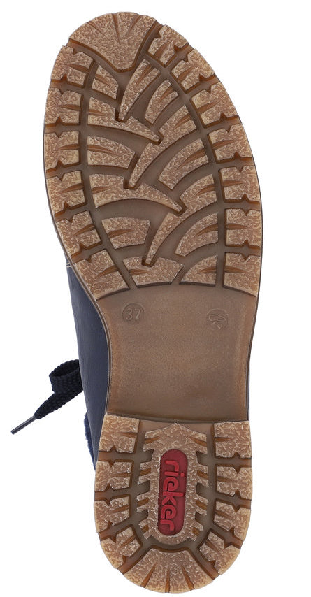 Close-up of a shoe sole with a brown tread pattern and the word "RICKER" in red.