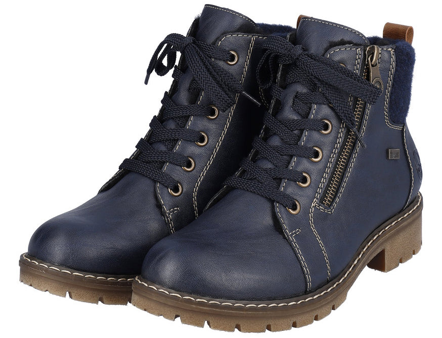 Blue lace-up ankle boots with side zipper and faux fur trim.