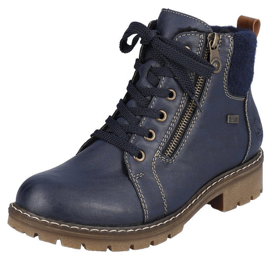 Blue ankle boot with laces and zipper, lug sole, faux fur trim at collar.