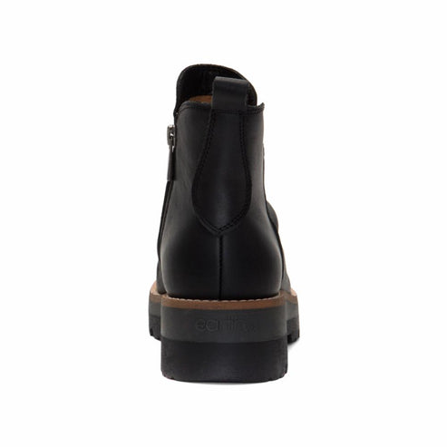 Rear view of a black, leather ankle boot with a side zipper and elastic ankle panel and a black lug sole.